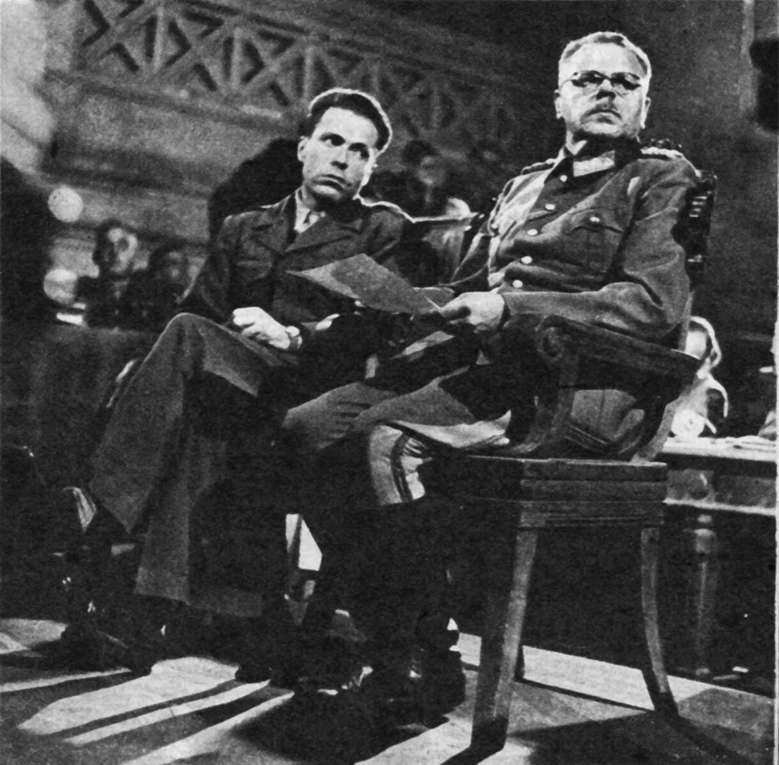 Dostler (right) with his interpreter, Albert O. Hirschman, at his trial.